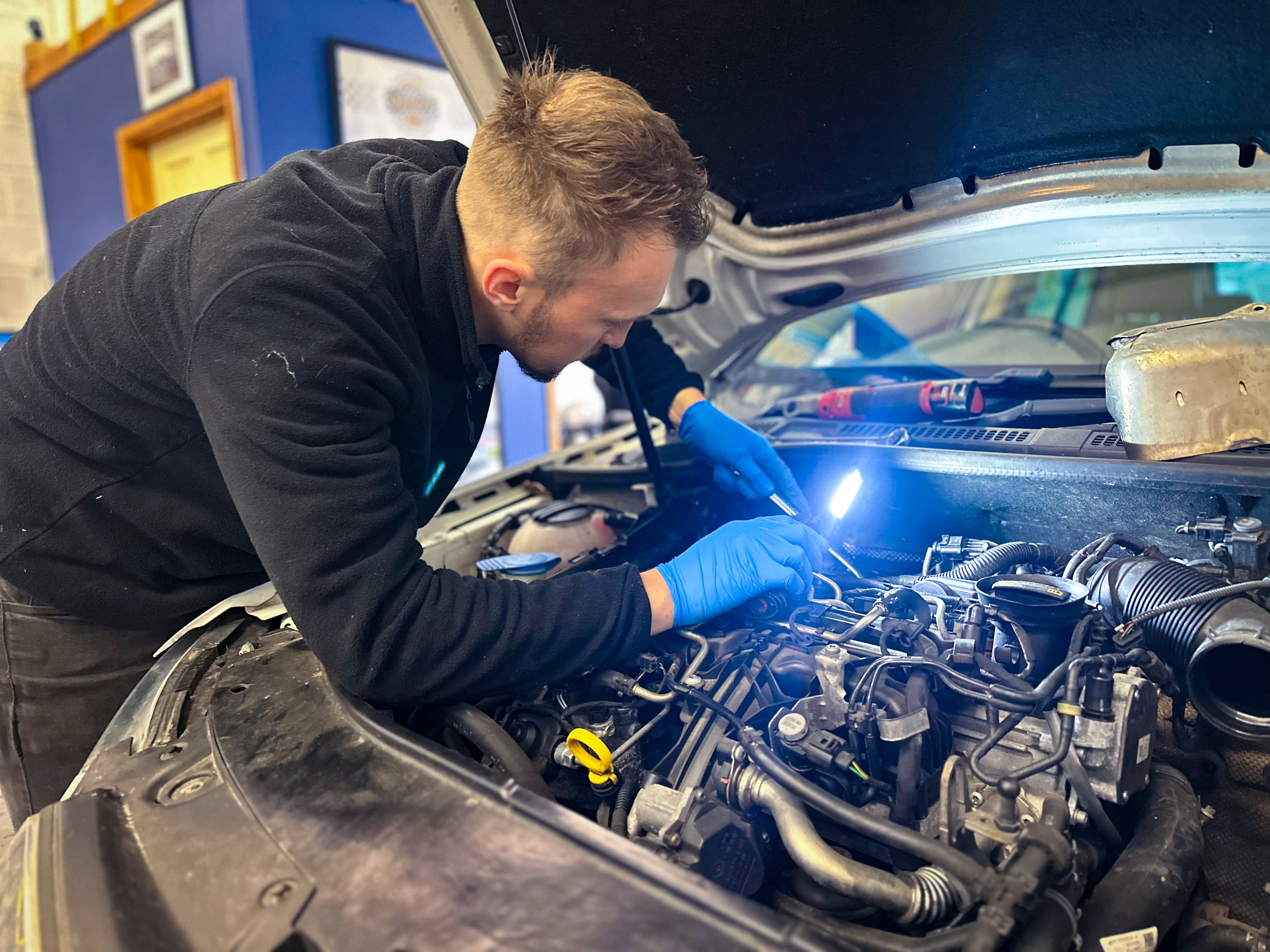 Coastal Motorsport technician carrying out engine diagnostics