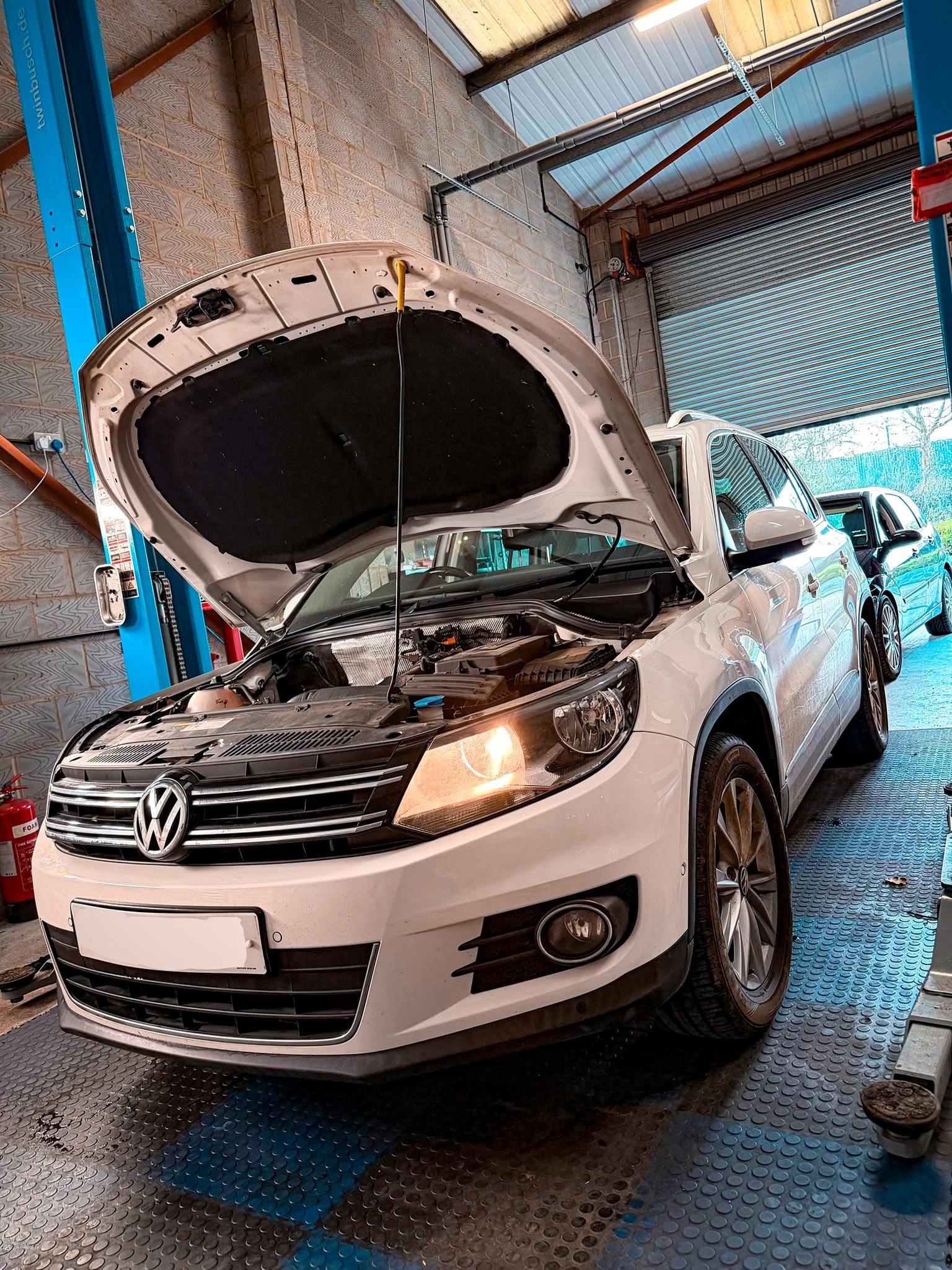 Volkswagen being serviced inside Coastal Motorsport workshop